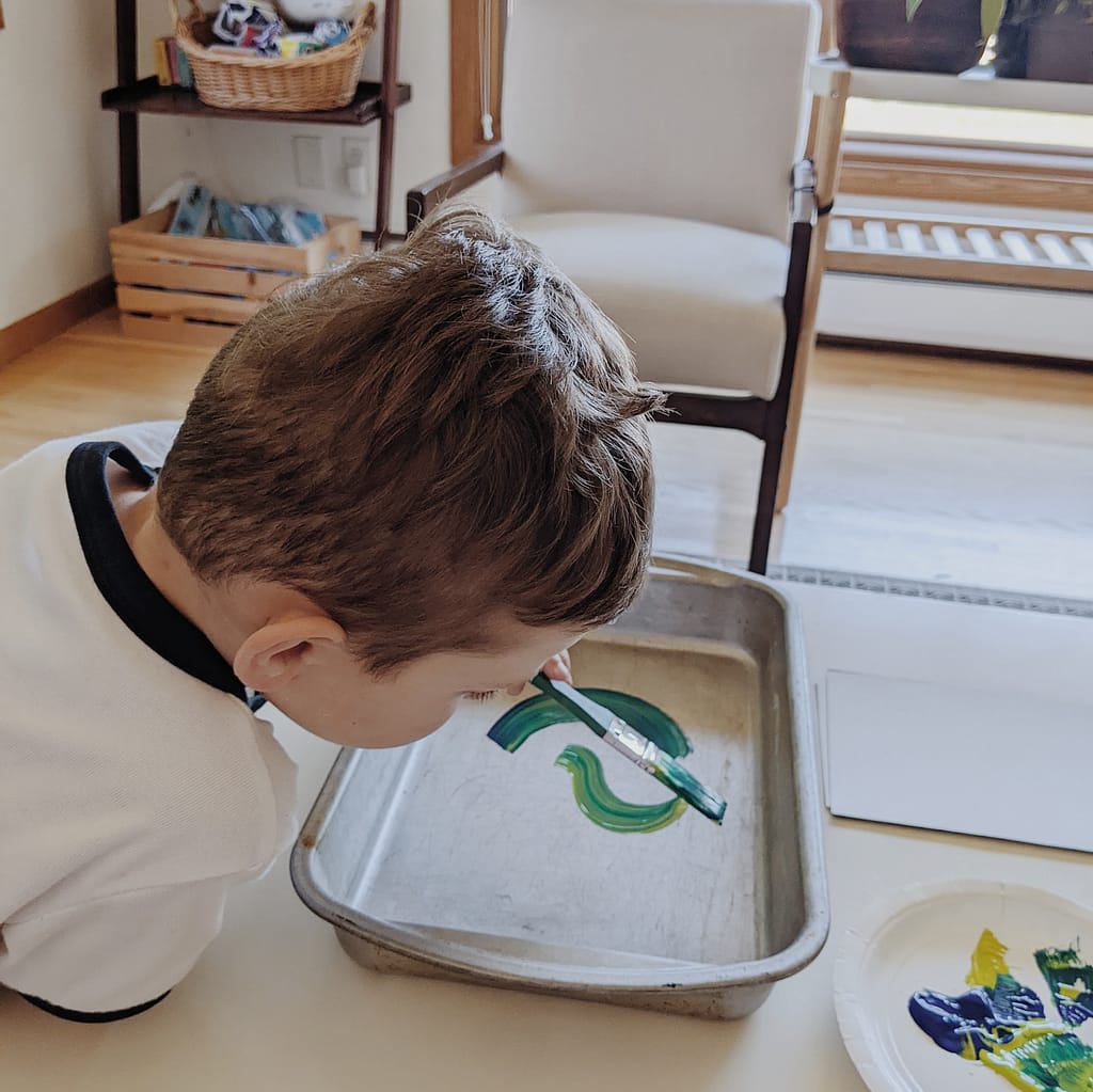 Cake pan printmaking for kids - painting by a preschooler - grow good humans