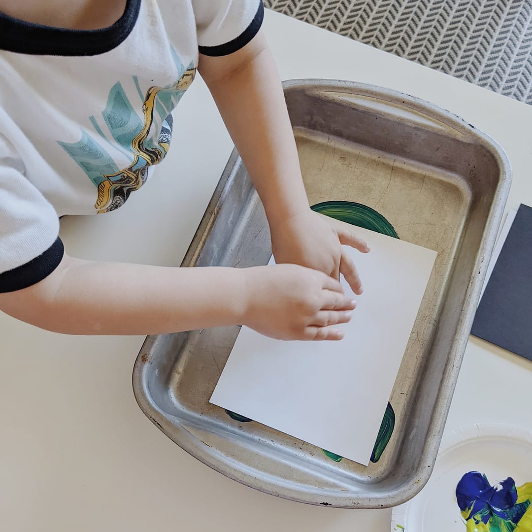 Cake pan printmaking for kids - paper step - grow good humans